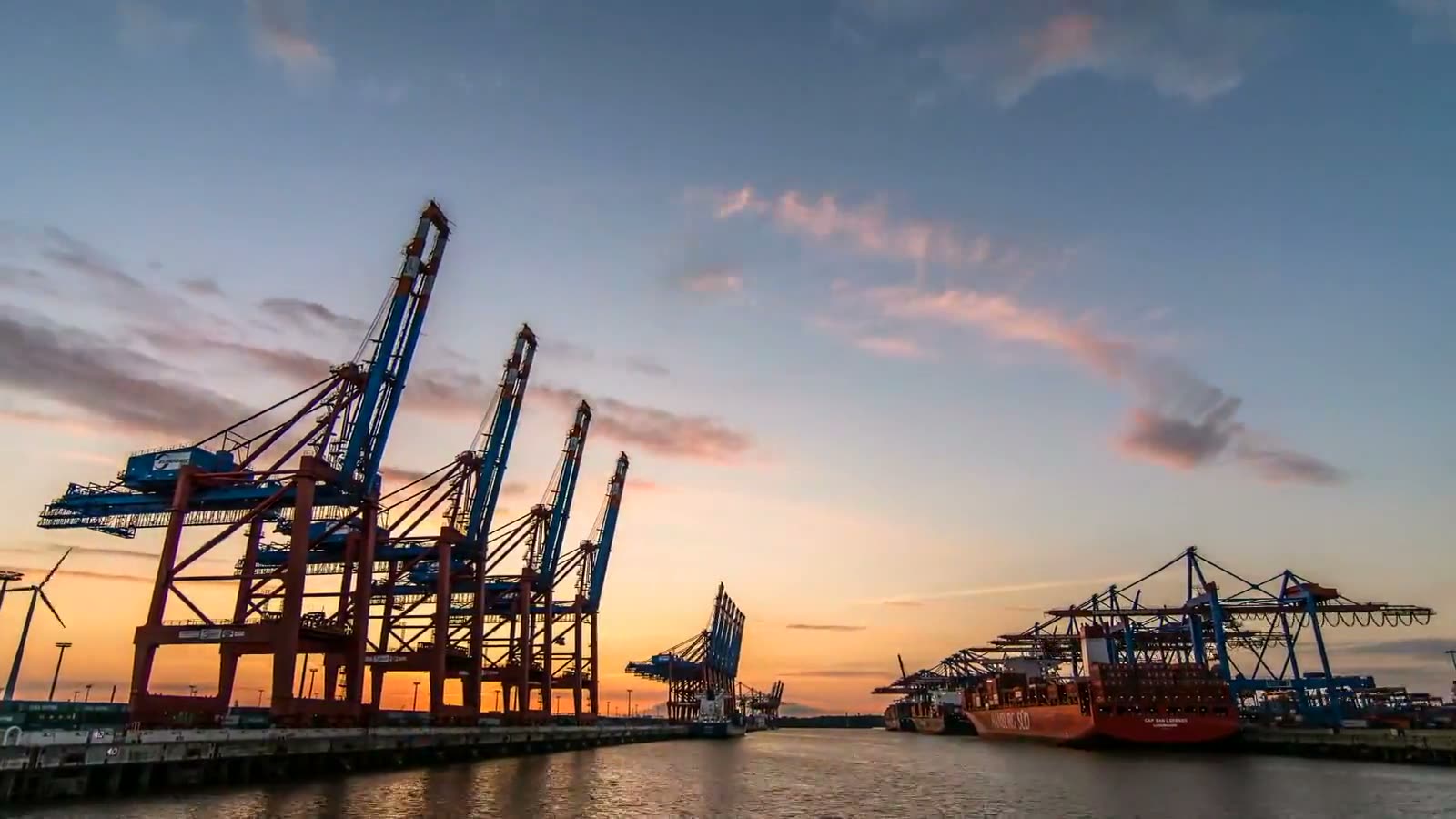 Container gantry cranes at golden hour